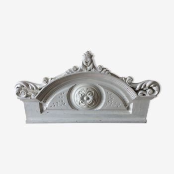 Old pediment in painted wood