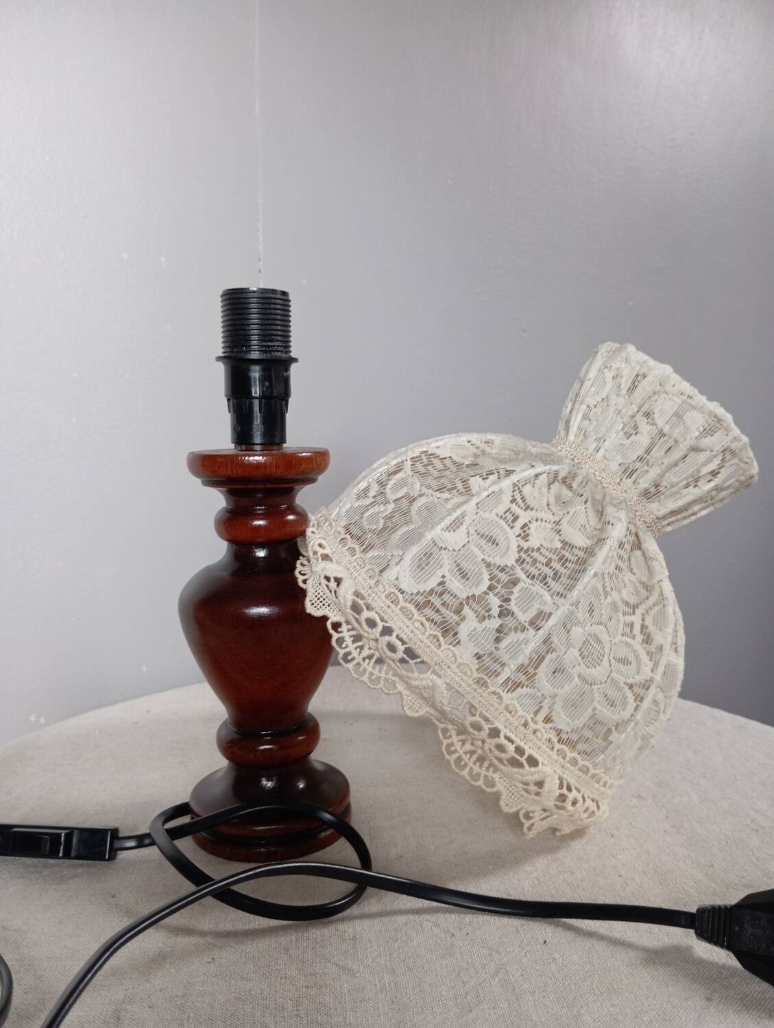Table lamp with romantic wood and lace ambiance, retro chic