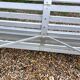 Old garden bench with metal legs and wooden slats