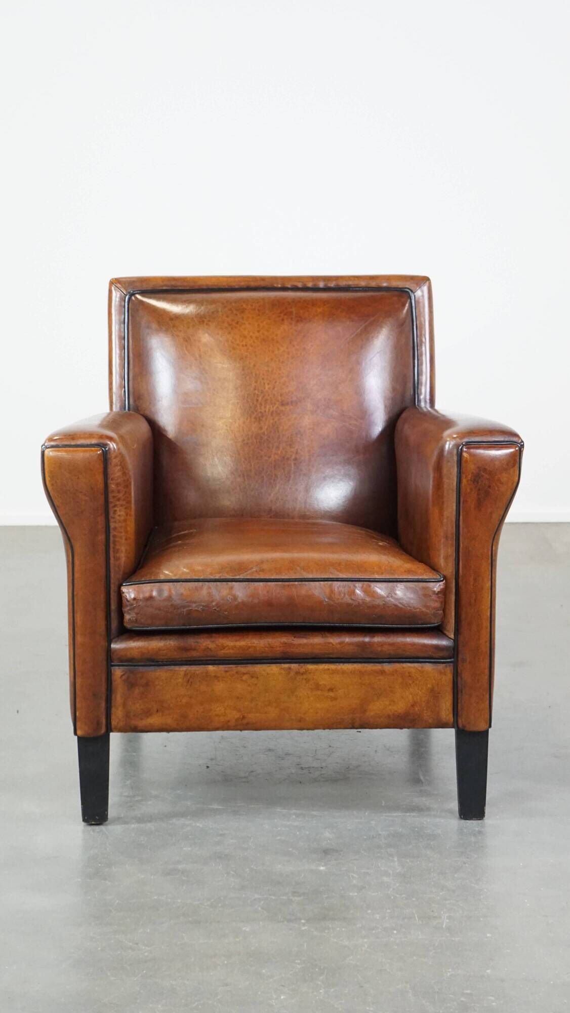 Cognac-colored sheep leather Art Deco design armchair finished with piping