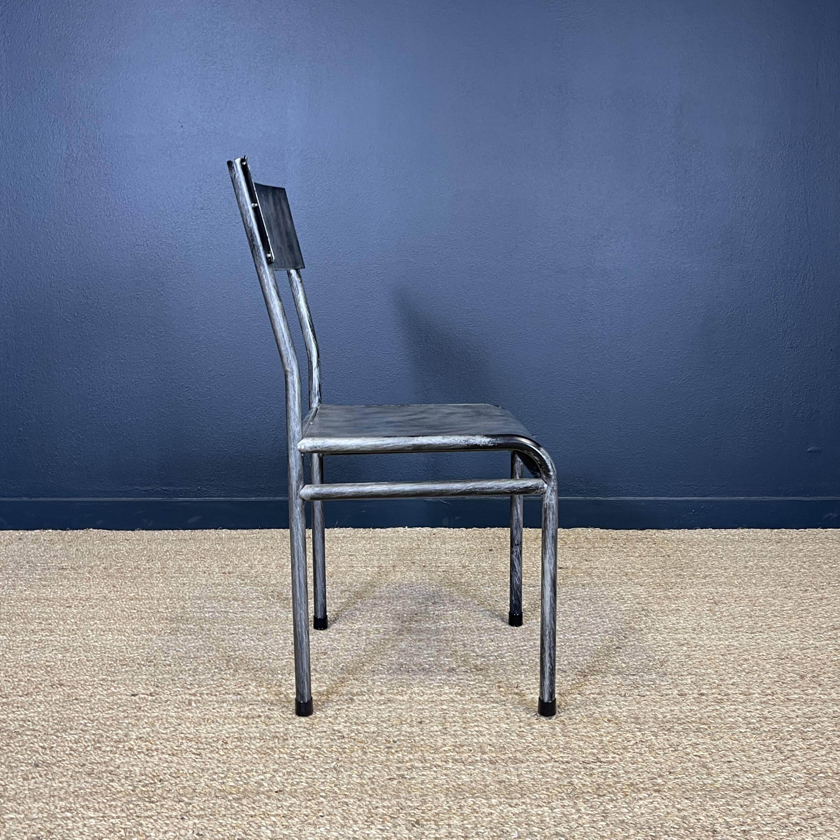 Pair of gray metal industrial chairs