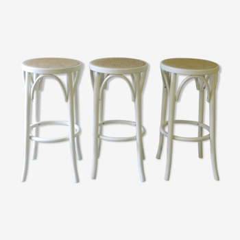 Trio of bar stools in cannage