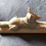Vintage ceramic lying dog on base