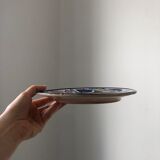 4 colorful flat plates with a fish pattern