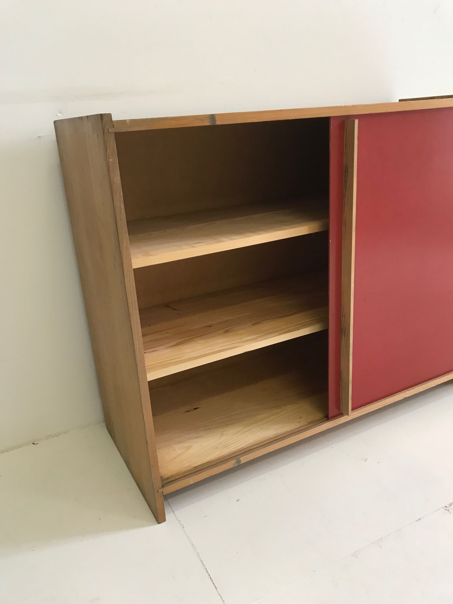 Vintage furniture with red sliding doors