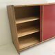 Vintage furniture with red sliding doors