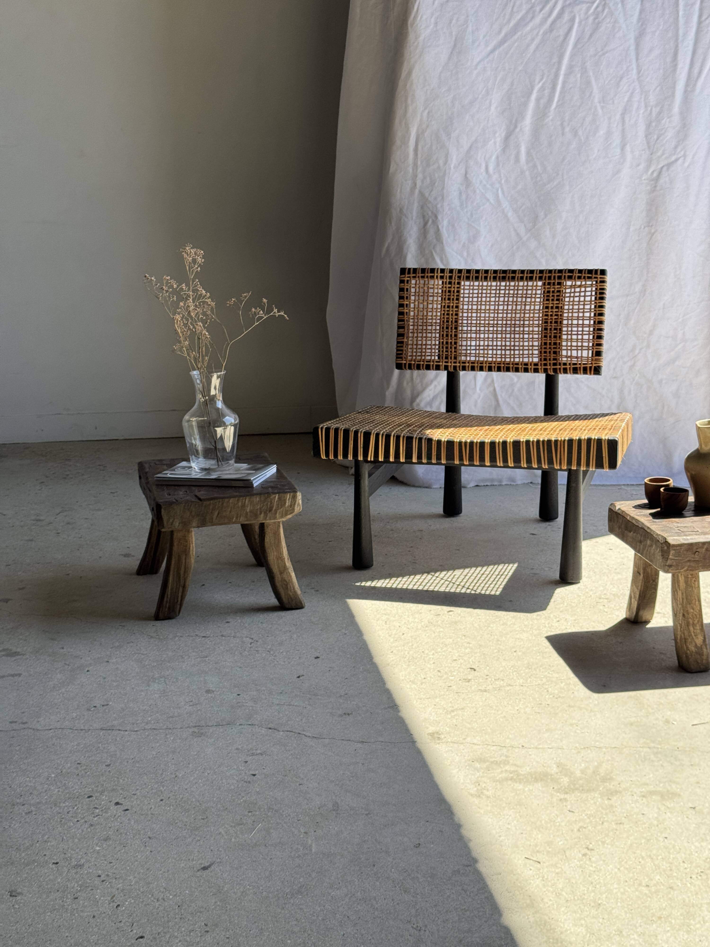 Small stool, rectangular solid teak side table with curved legs.