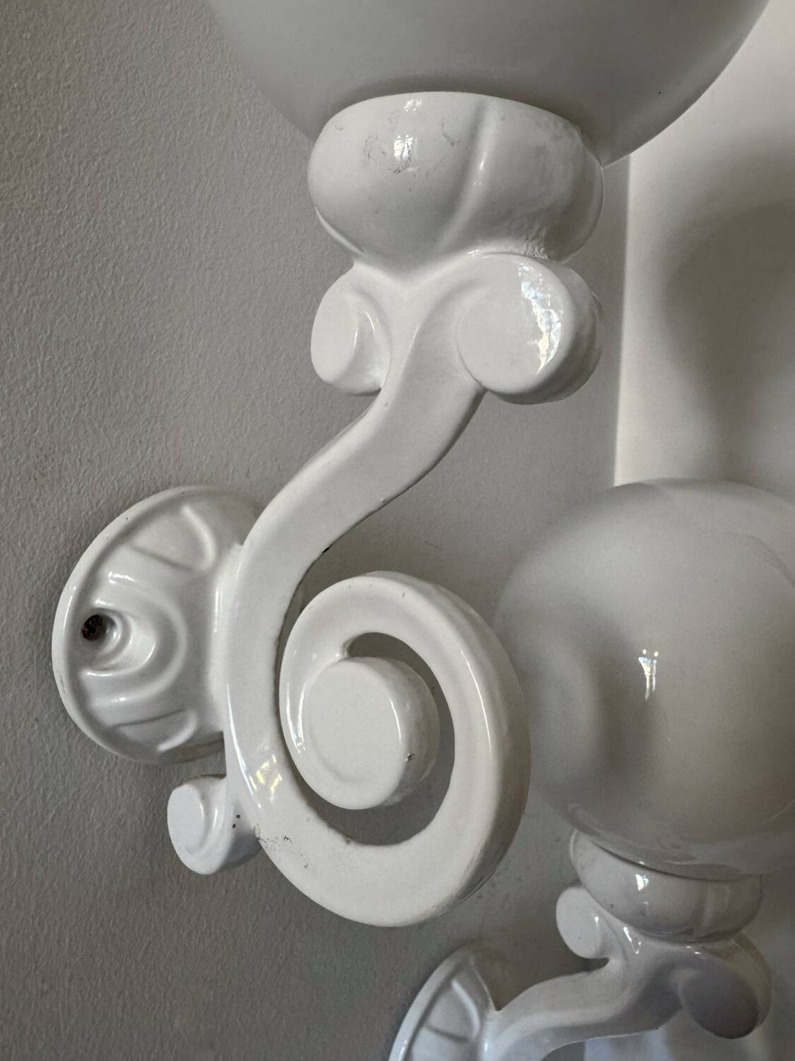 Cast iron and opaline wall lights from the 70s