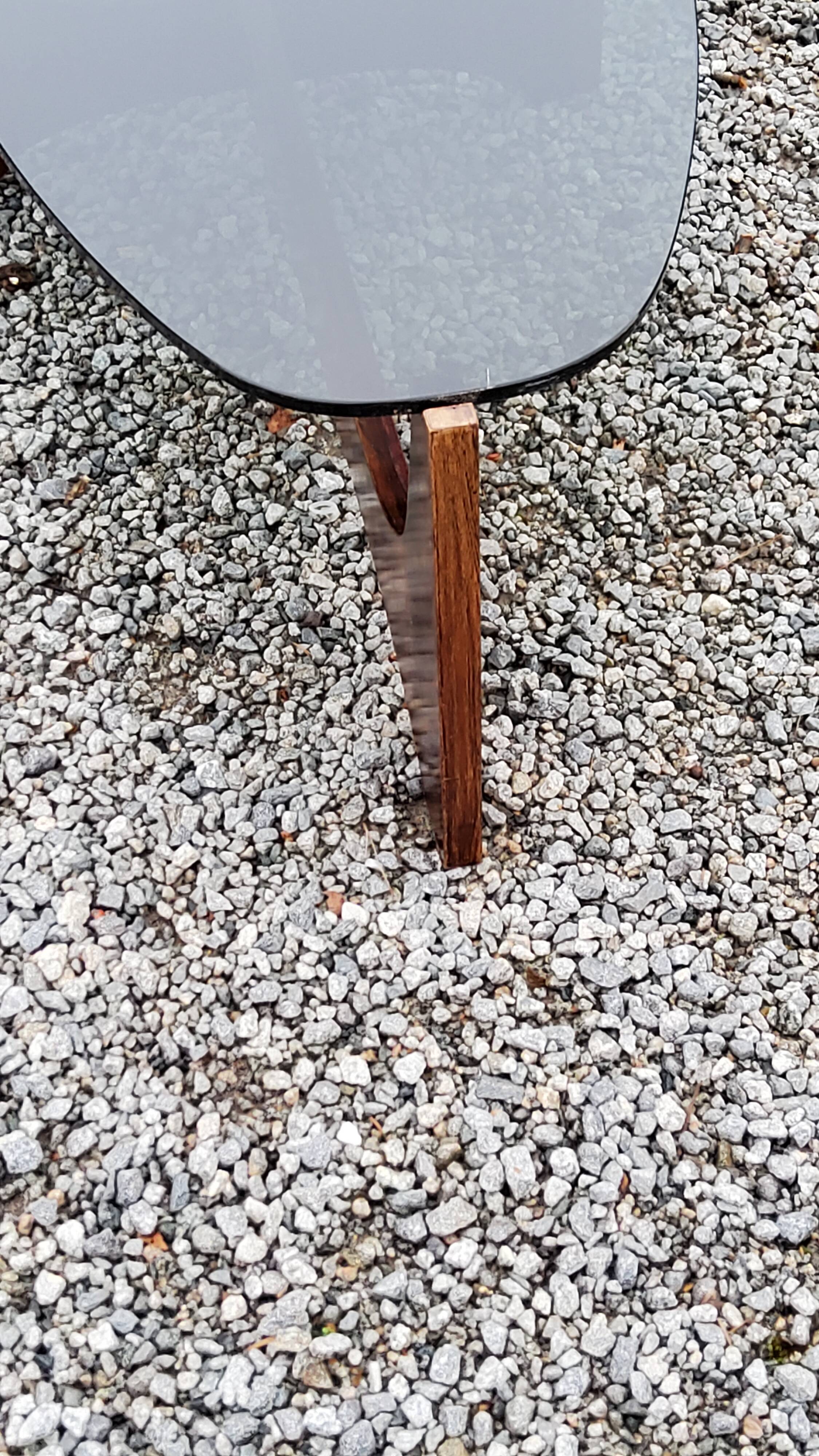 Designer coffee table by Hugues Poignant in rosewood and smoked glass from the 70s