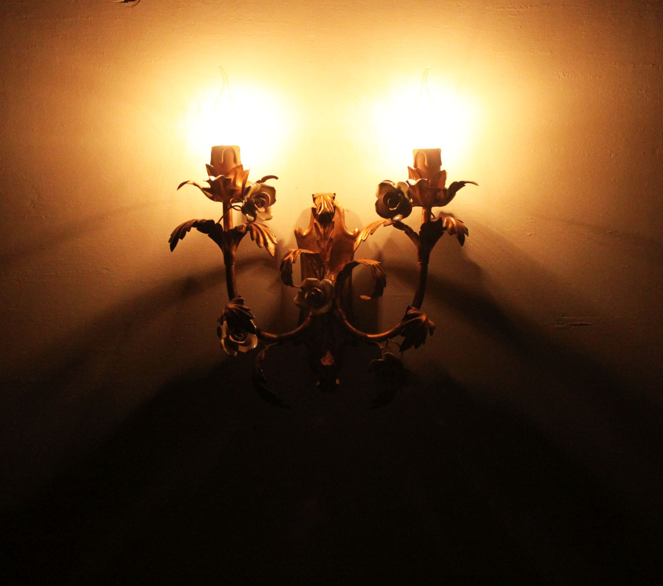 Pair of gold wall sconces with porcelain flowers