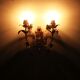 Pair of gold wall sconces with porcelain flowers