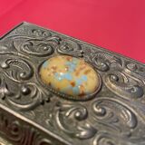 Ancient box made of chiseled metal and stone