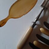 29-piece horn cutlery set, knives and serving utensils.