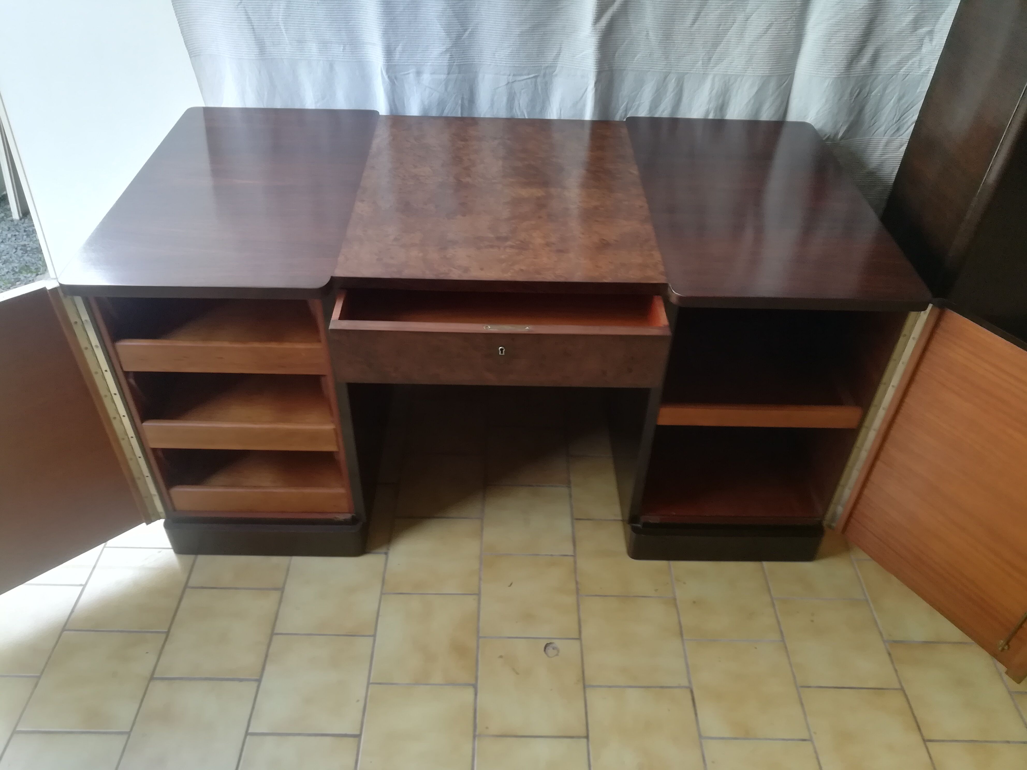 Art deco desk in rosewood and magnifying glass