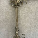 Adjustable wall light in brass and gold metal.