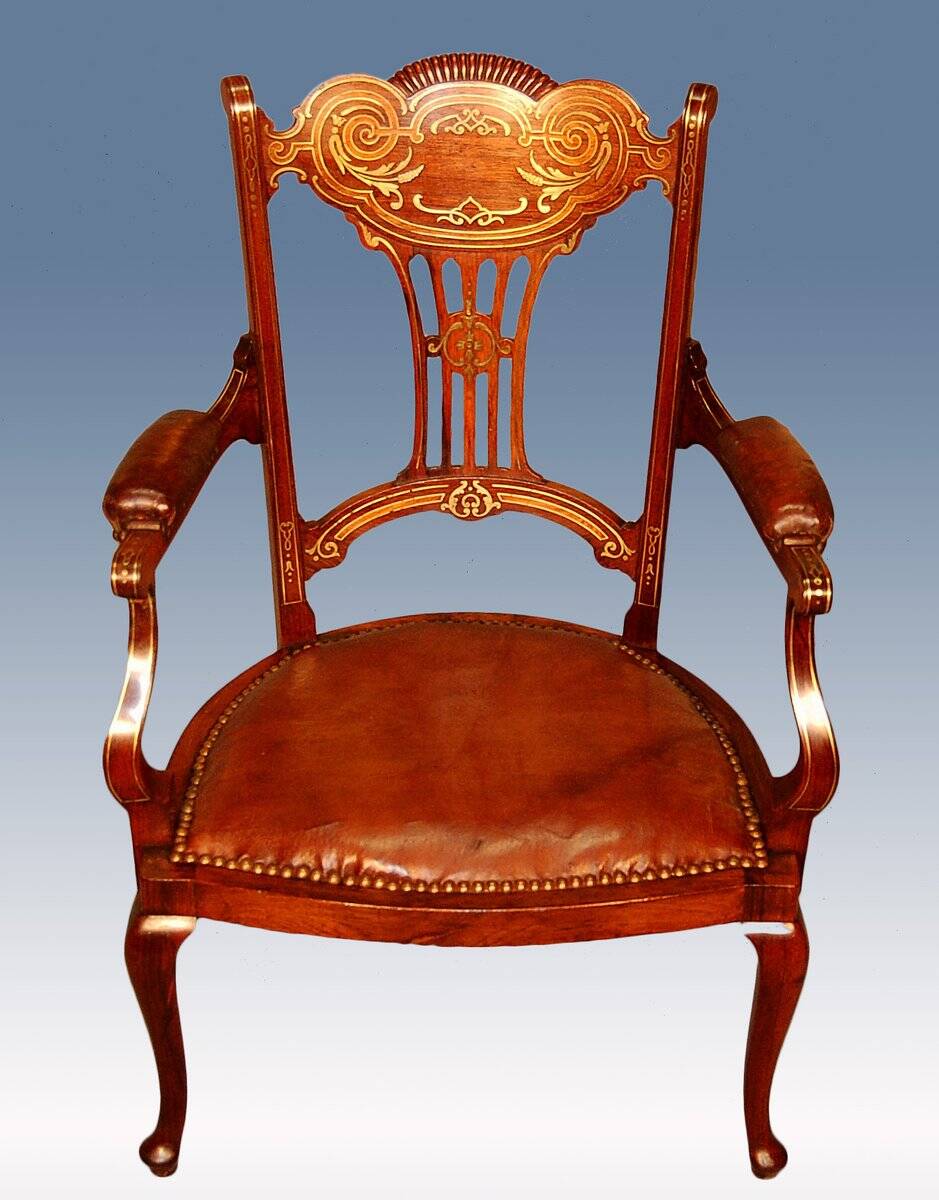 19th century armchair in leather and rosewood inlaid with brass and rosewood