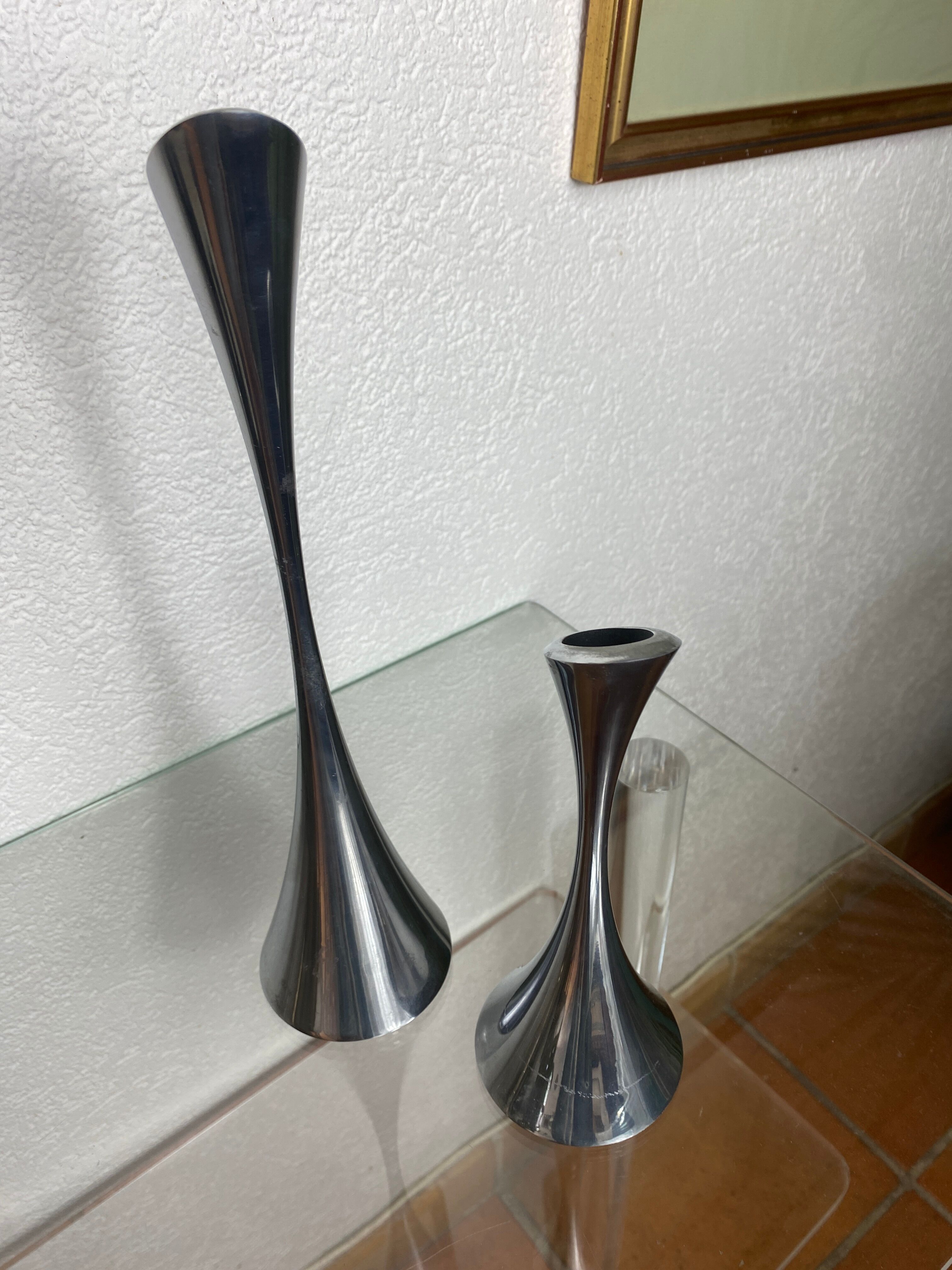 Pair of designer candle holders in stainless steel
