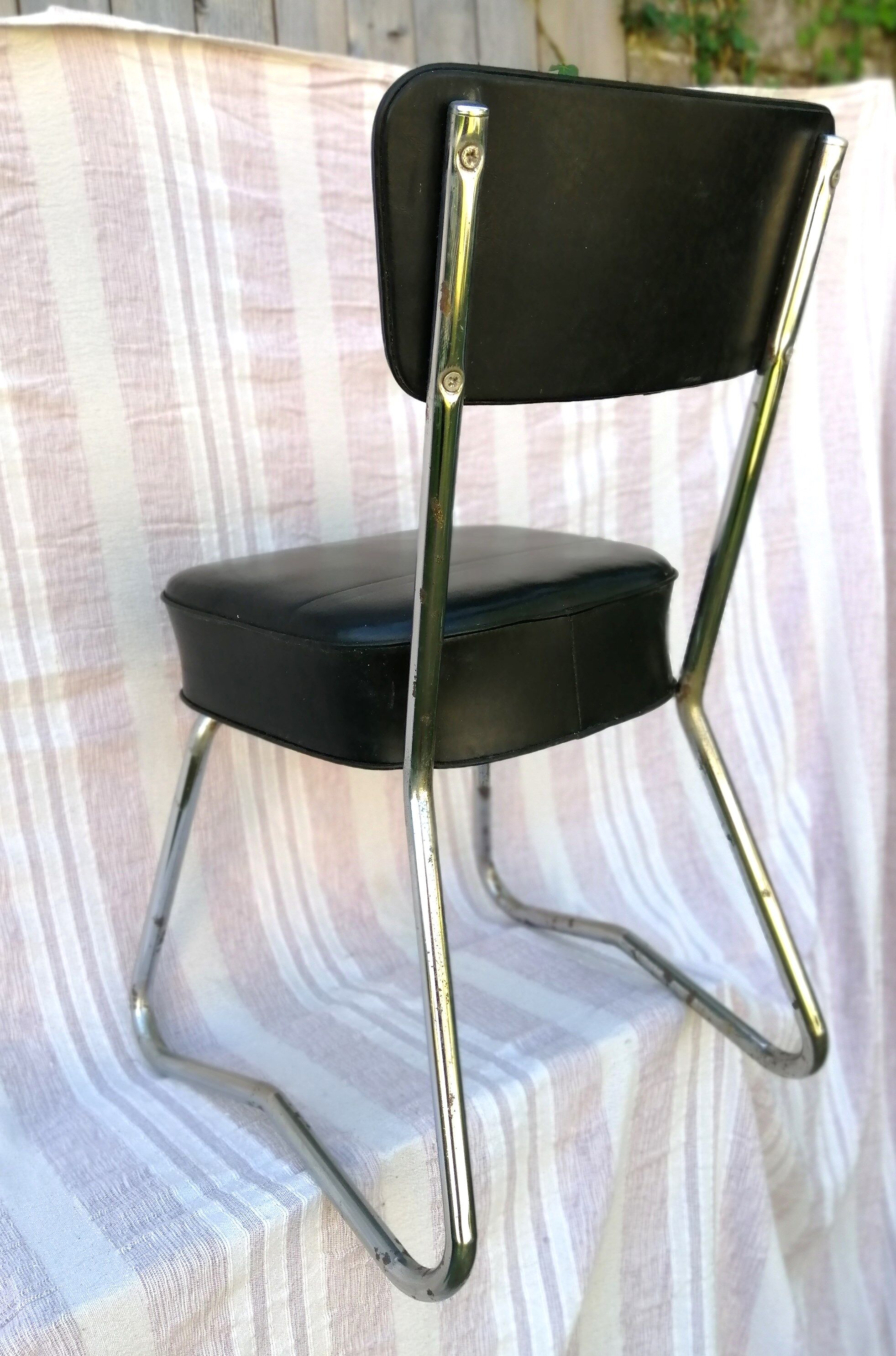 Chrome and skai industrial chair