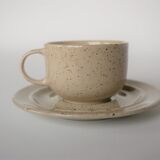Coffee cup and vintage pyrity sandstone subcup