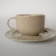 Coffee cup and vintage pyrity sandstone subcup