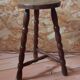 Tripod stool with turned legs