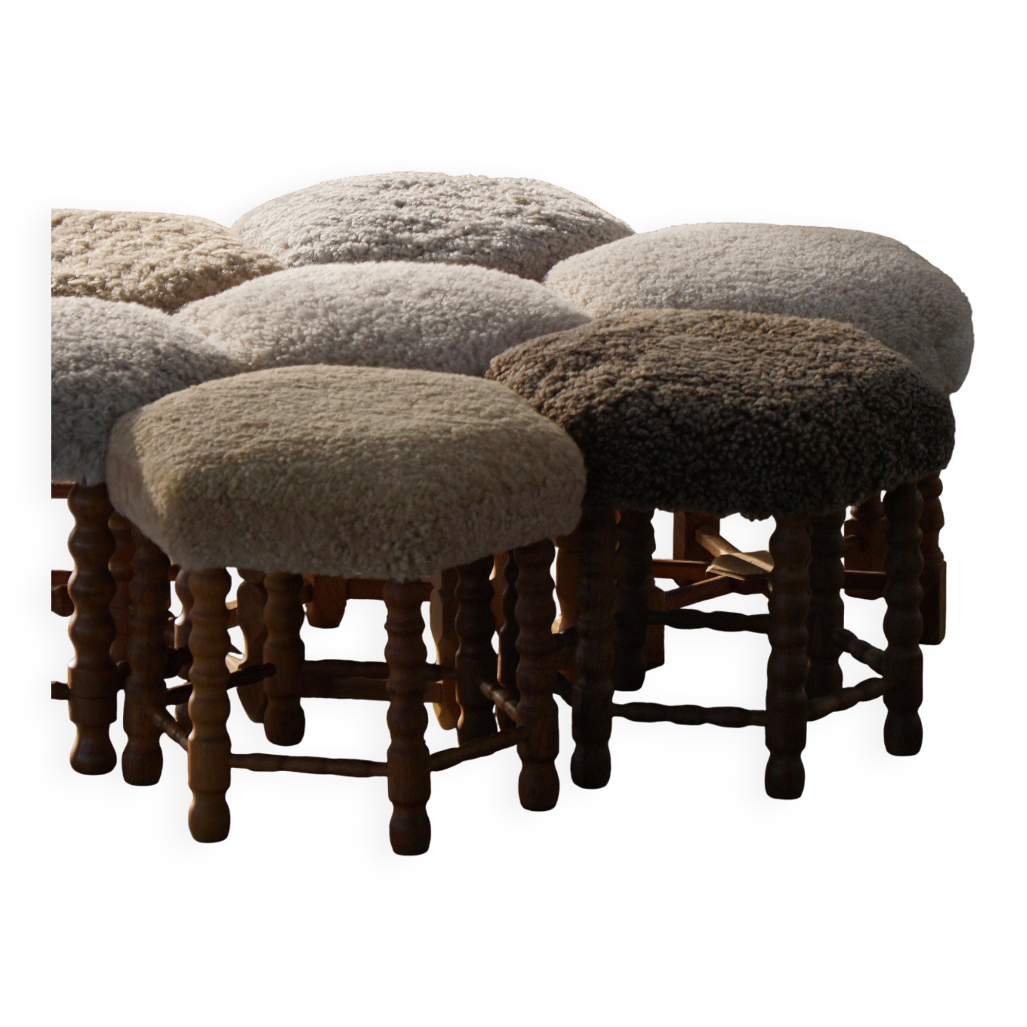 Pair of mid-century Danish oak stools with shearling lambswool upholstery, 1950s.