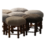 Pair of mid-century Danish oak stools with shearling lambswool upholstery, 1950s.
