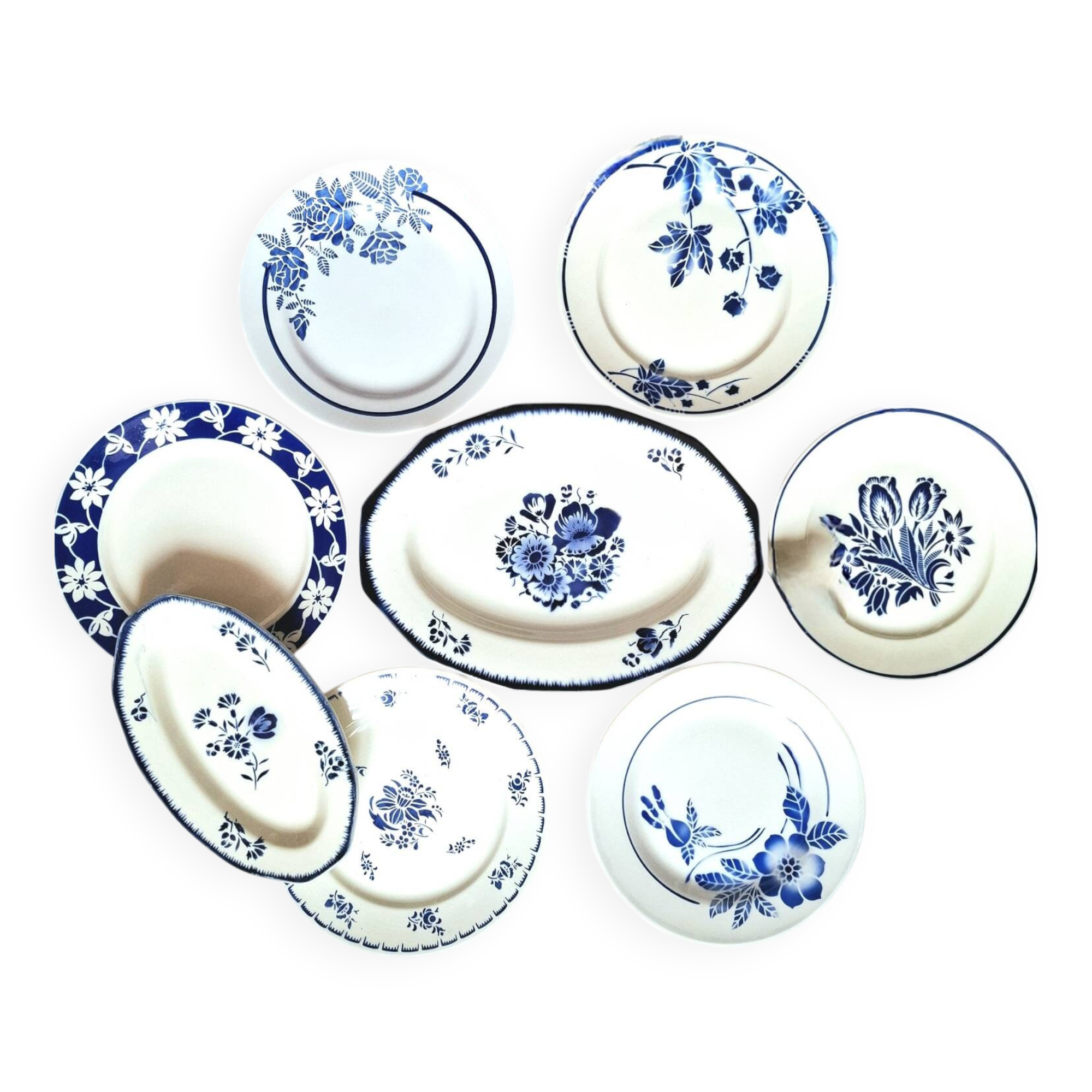 Mismatched antique flat plates accompanied by dishes.