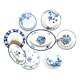 Mismatched antique flat plates accompanied by dishes.