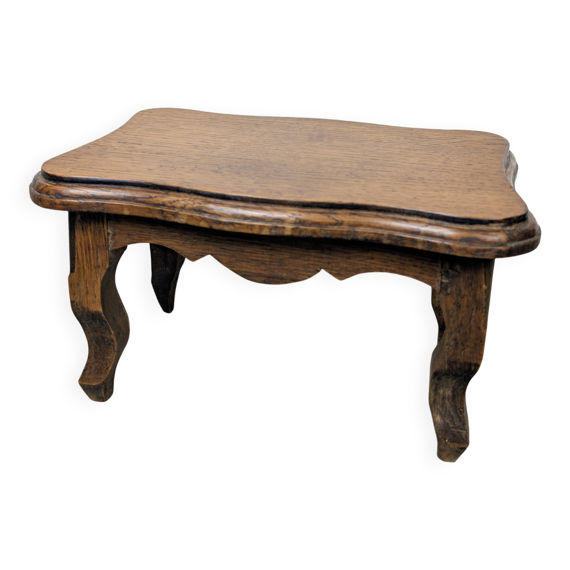 Antique footstool with rustic charm