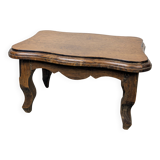 Antique footstool with rustic charm