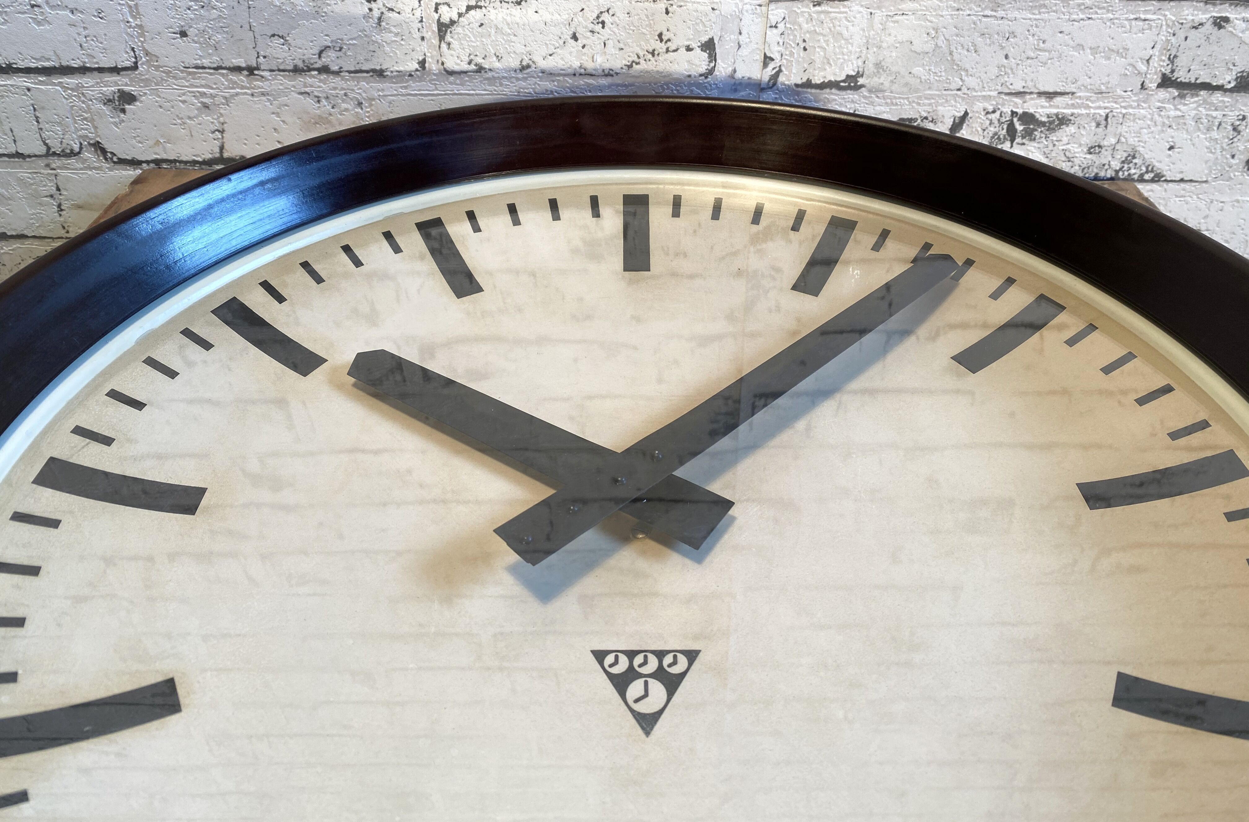 Industrial bakelite factory wall clock from Pragotron, 1960s