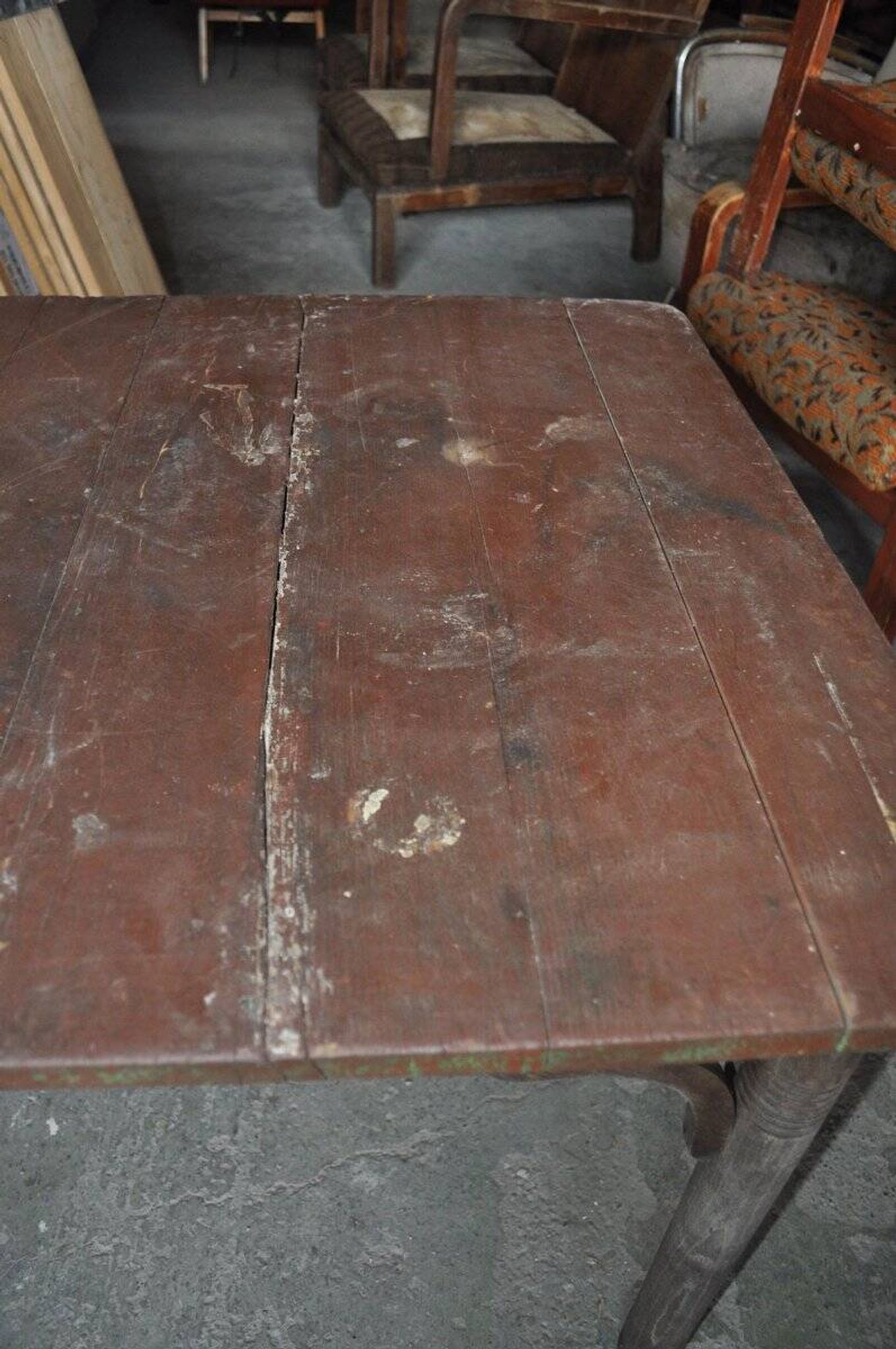 Rustic Thonet table in brown beech, circa 1920, with slatted top and turned legs.