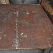 Rustic Thonet table in brown beech, circa 1920, with slatted top and turned legs.