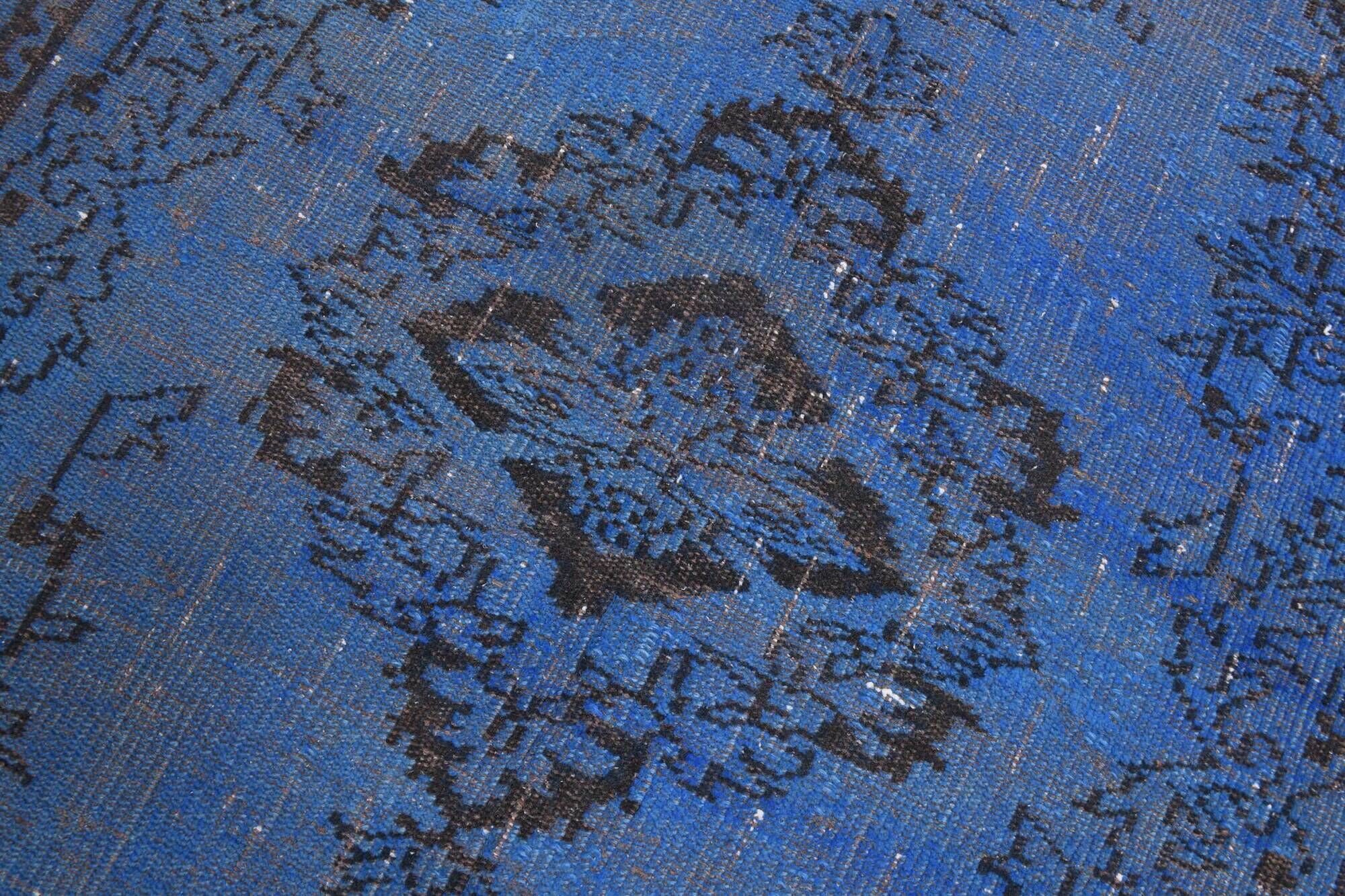 Vintage blue and black Turkish rug with traditional design, 163 × 268 cm