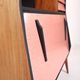 Vintage retro wooden storage furniture with salmon-coral accents and tapered legs, 1950s.