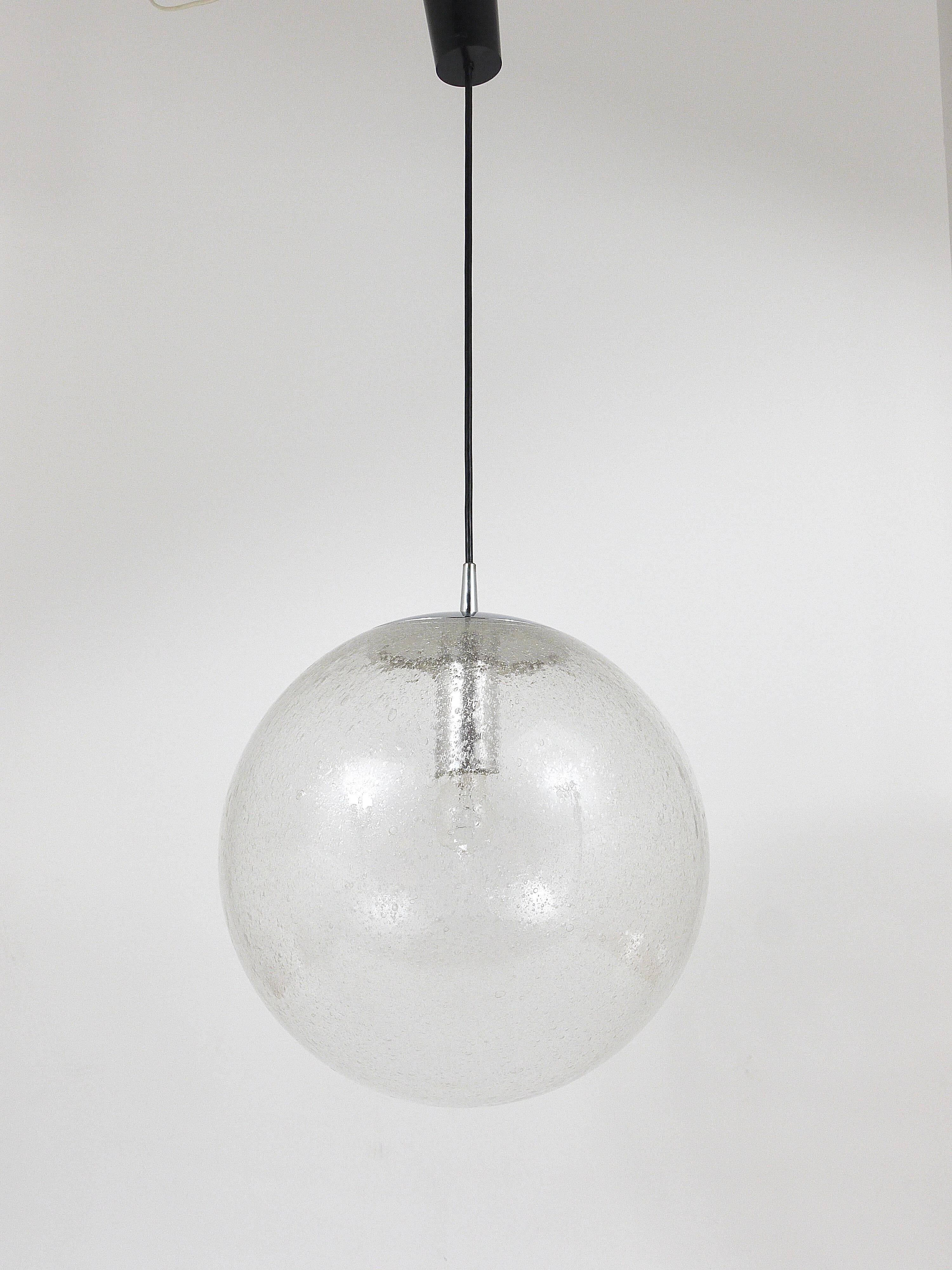 Large glass globe pendant light with bubbles and chrome by Peil & Putzler, Germany, 1970s.