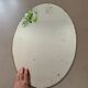 Old bevelled stitched oval mirror