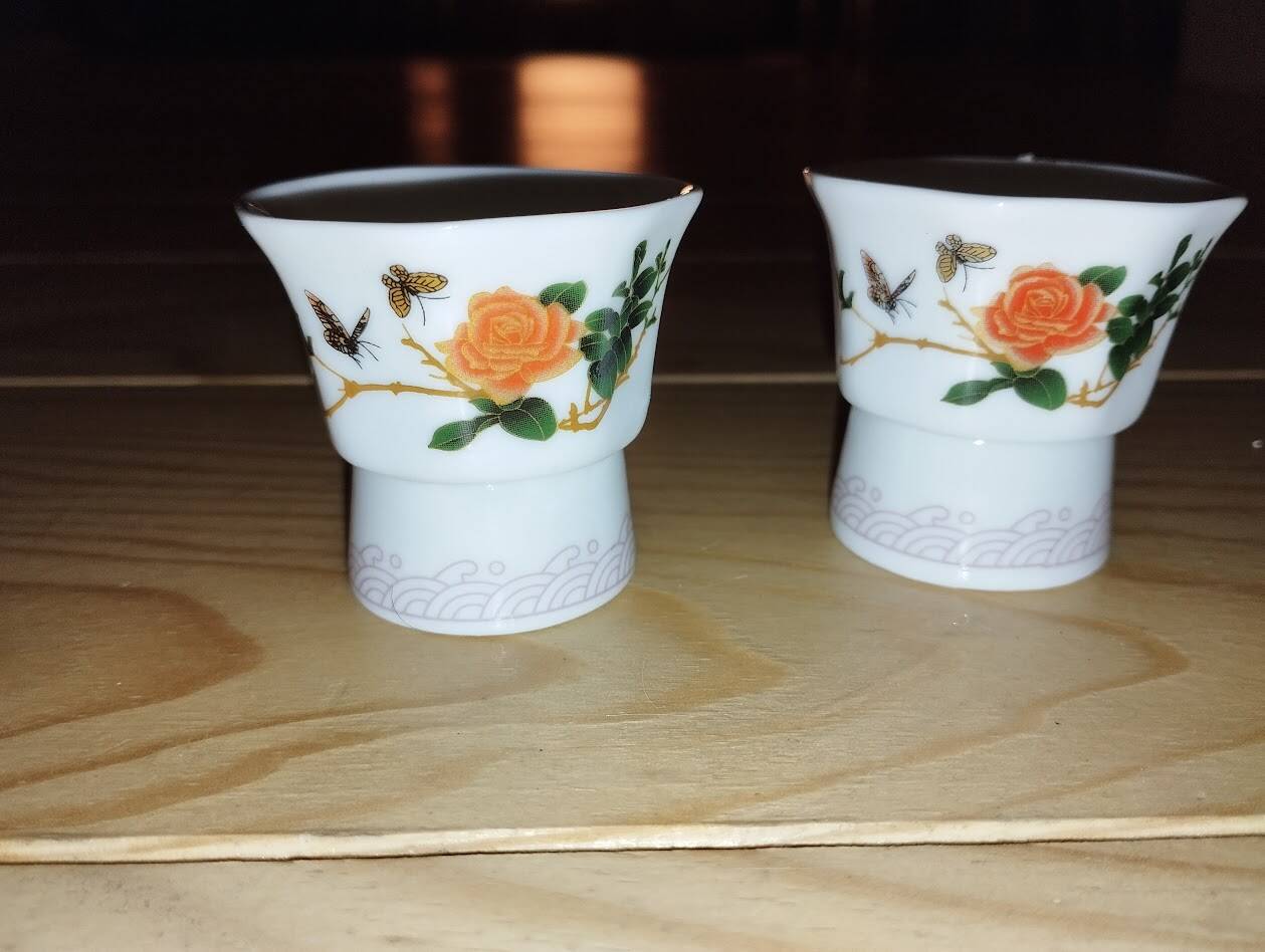 Pair of antique glass egg cups – Floral & insect decoration – Po