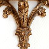 Golden wood wall console in Louis XV style.