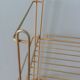 String shelf in golden metal wires