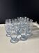 Set of 32 vintage glacier blue engraved stemmed glasses.
