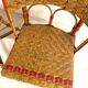 Set of 4 antique chairs in woven red and natural rattan.