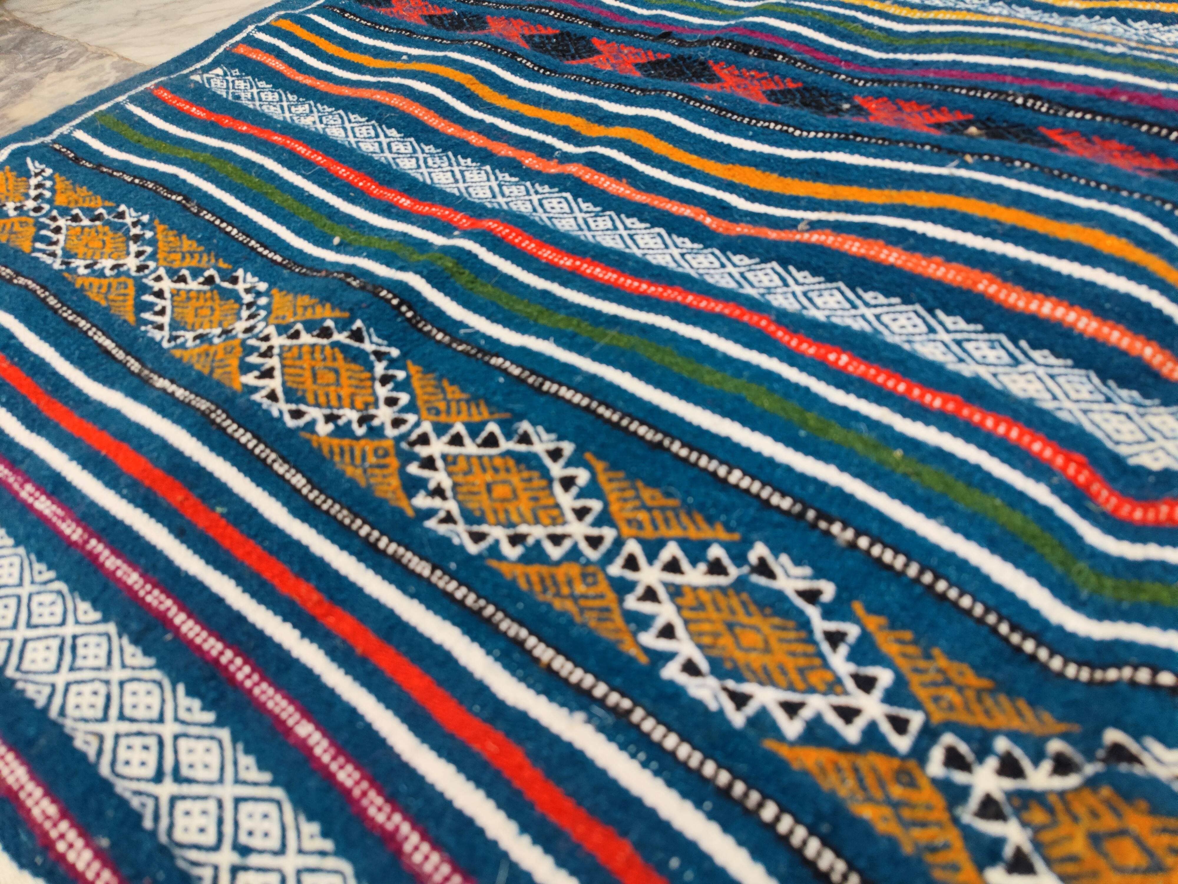 Handwoven blue kilim rug in natural wool