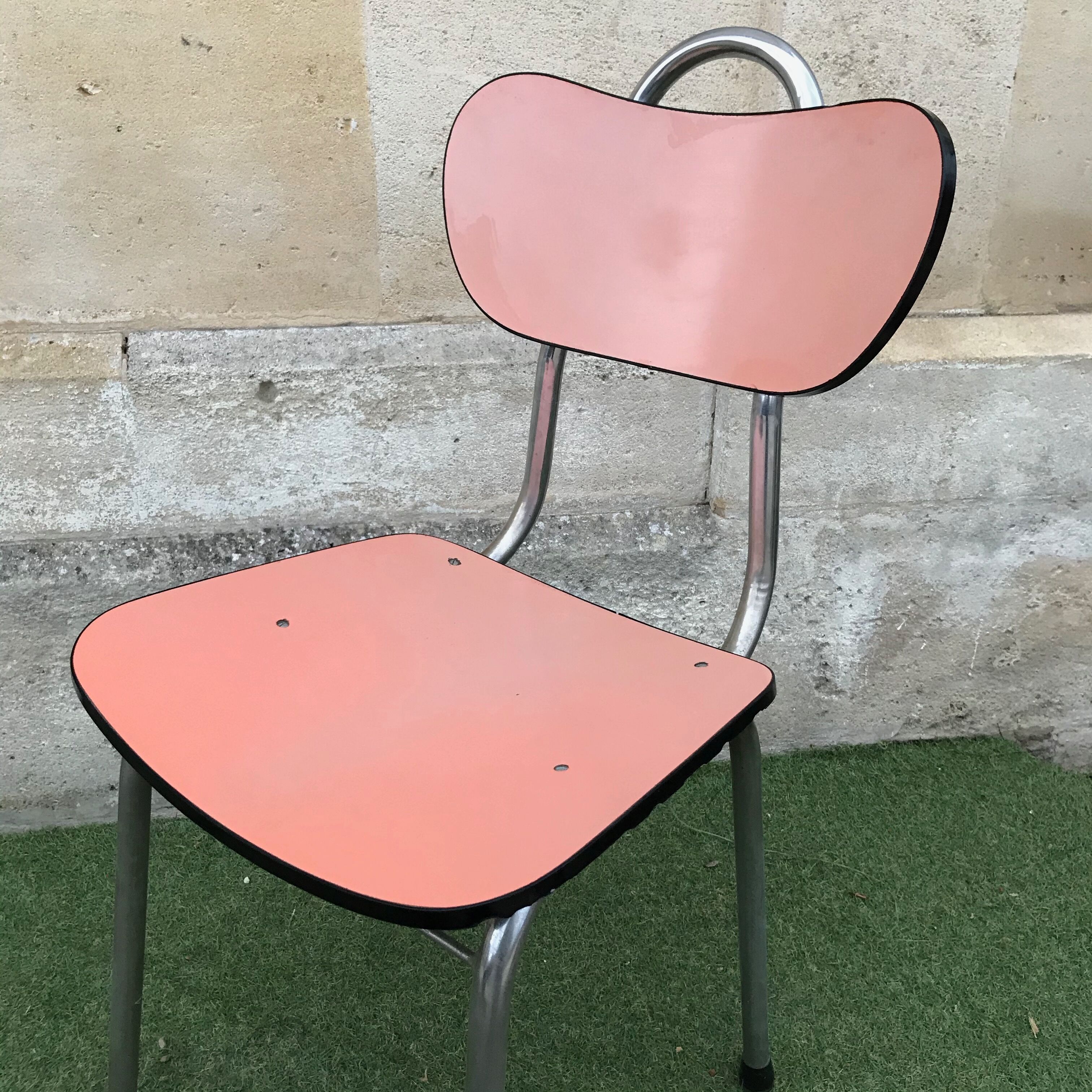 Pink chair in formica