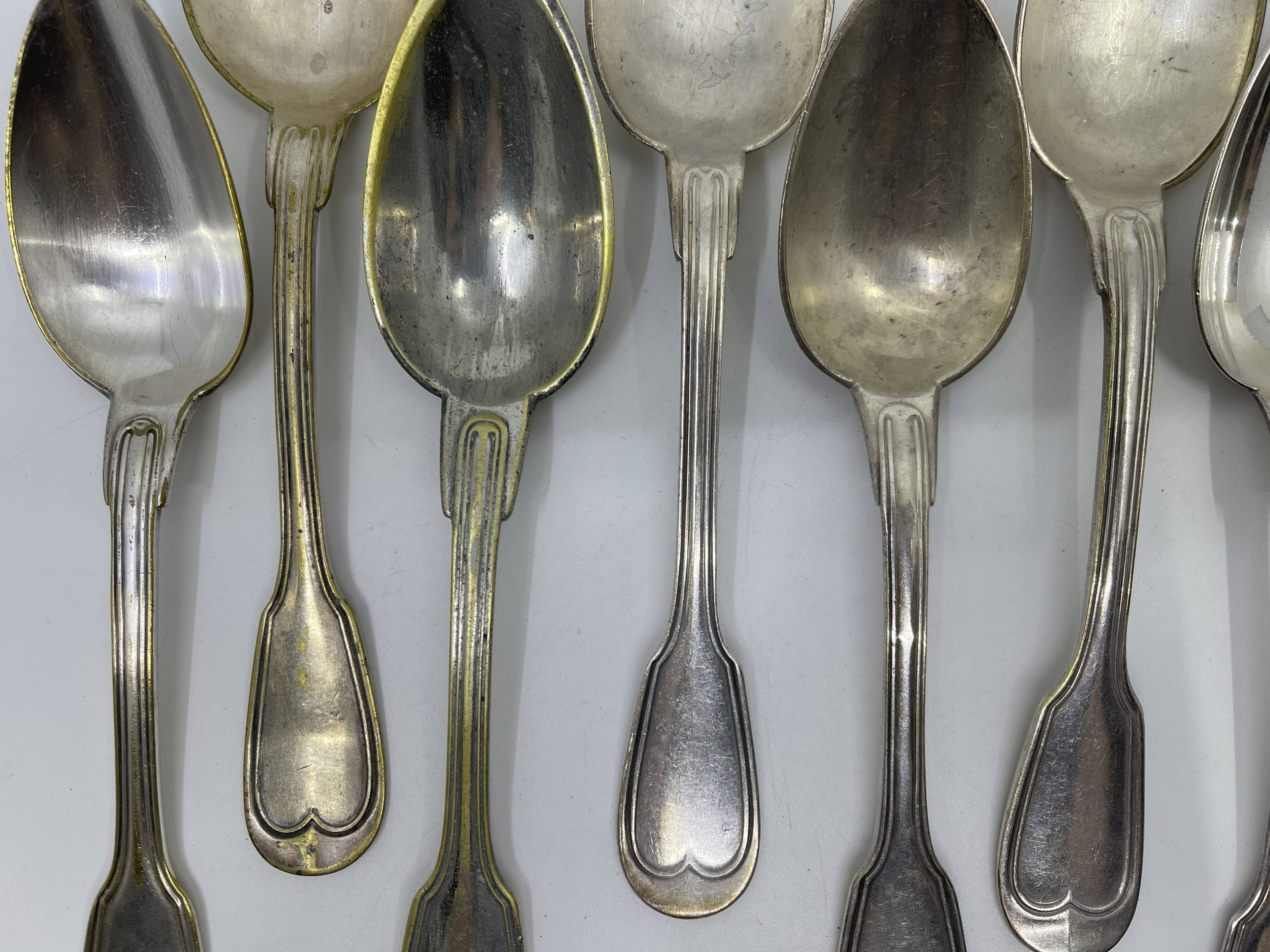 Set of 9 silver-plated soup spoons with a bi-lobed filet pattern.