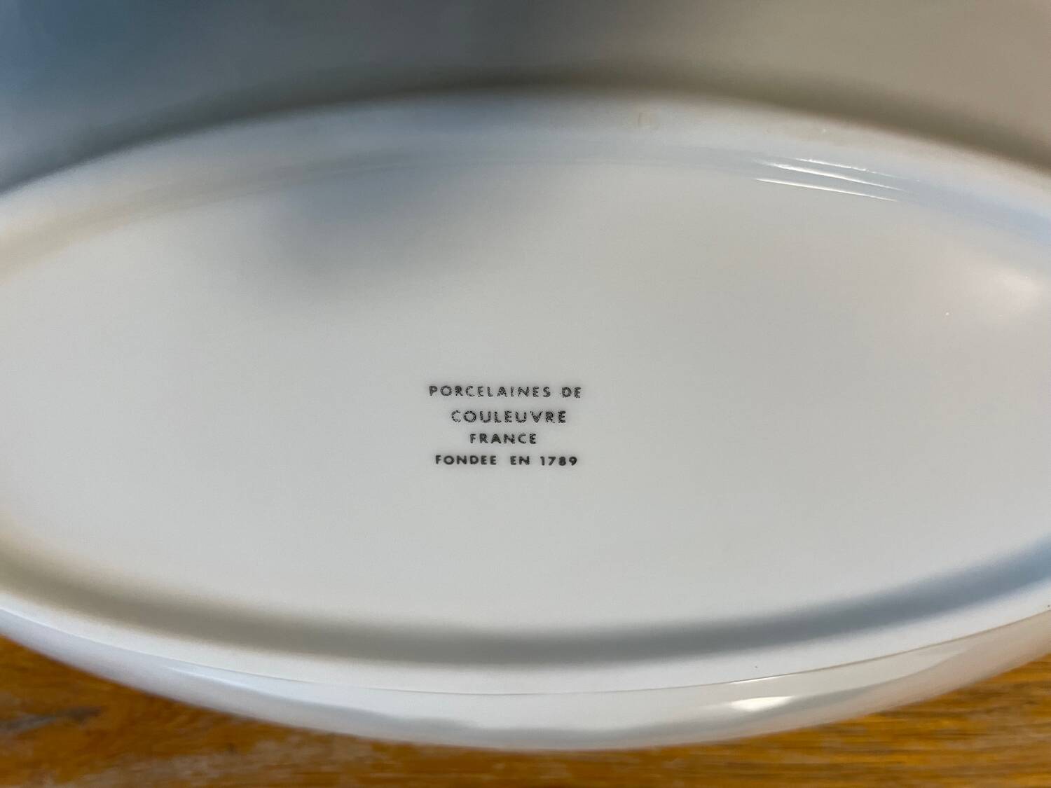 Set of two snake-patterned porcelain dishes.