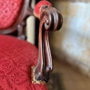 Napoleon III medallion armchair in carved wood and red velvet.