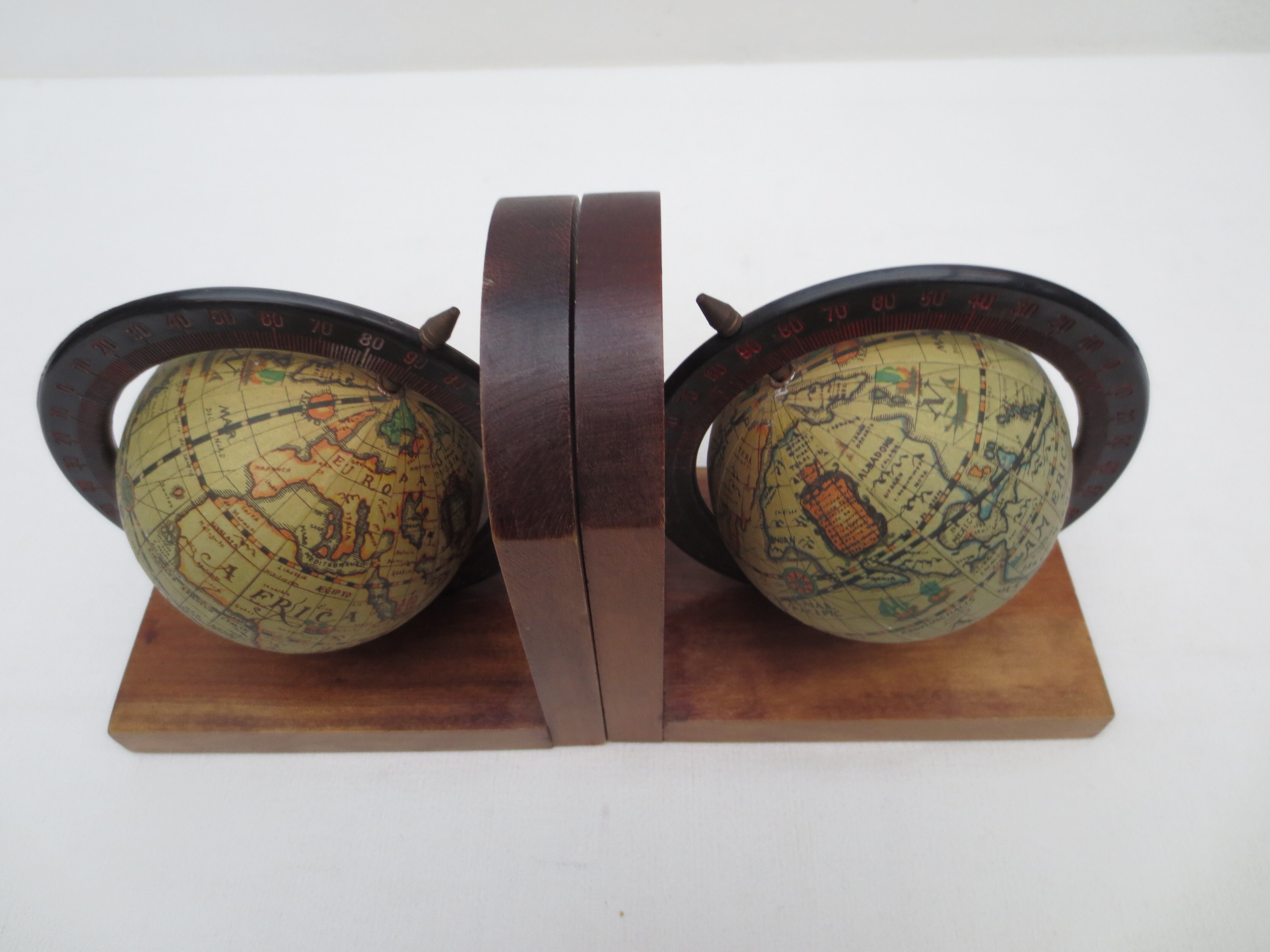 Old pair of greenhouse books in solid wood and world map