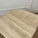 Travertine coffee table in eye shape.